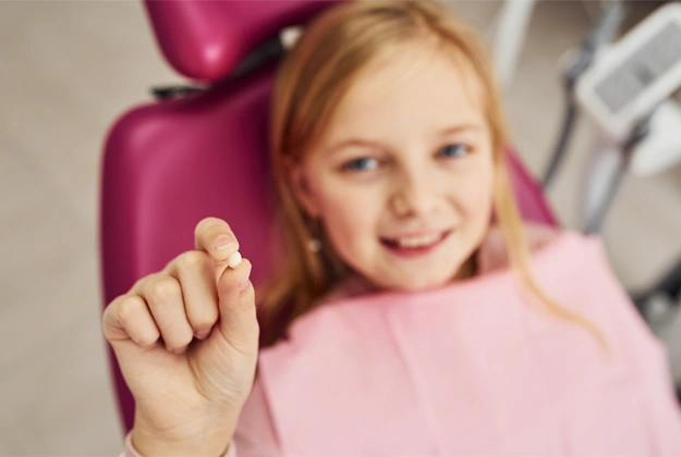 A child having dental pain in camarillo and tooth extraction treatment